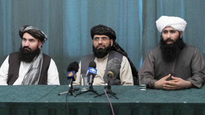 Taliban delegation members attend a news conference in Moscow